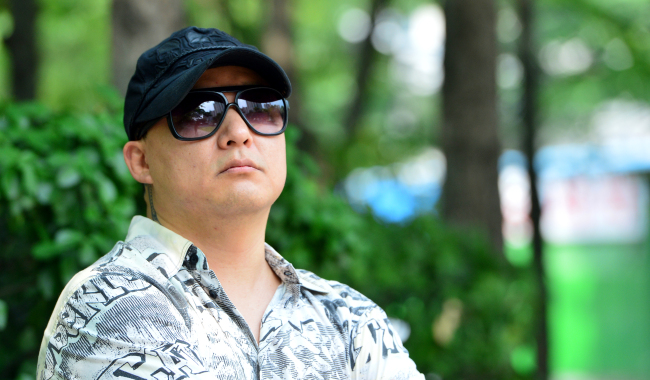 Singer Shin Hae-chul poses before an interview with The Korea Herald on July 14. (Yoon Byung-chan/The Korea Herald)