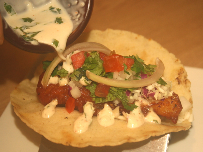 Coreanos Kitchen’s soon-to-be-released fish taco will feature batter-fried cod draped with a cilantro-cream sauce. (Jean Oh/The Korea Herald)