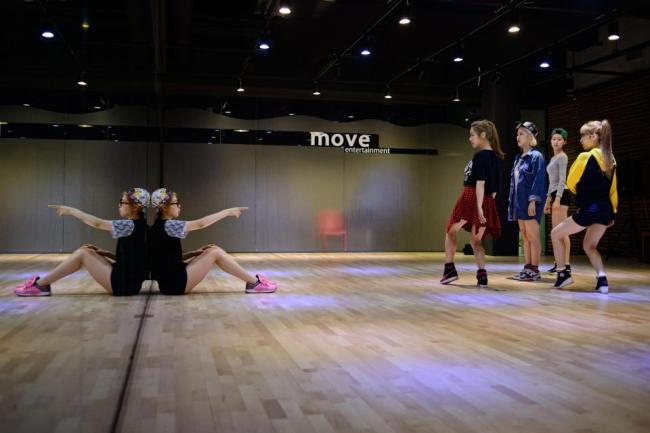 K-pop group 'Billion' rehearse at their studio in Paju, north of Seoul, June 10.  (AFP)