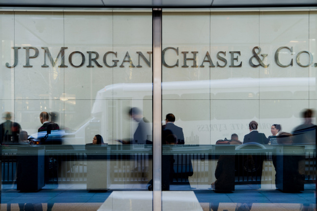 People stand inside the lobby of the JPMorgan Chase & Co. headquarters building in New York. (Bloomberg)