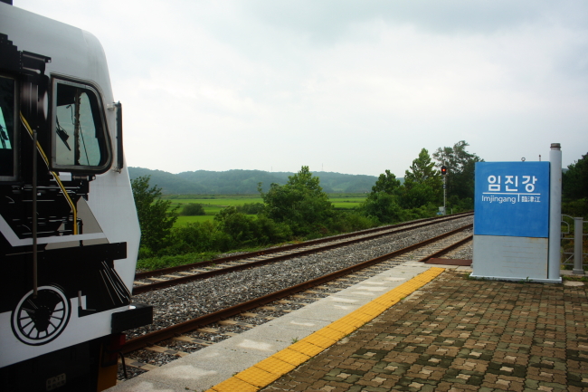 The DMZ Peace Train rests at Imjingang Station while passengers undergo document screening. (Matthew Crawford/The Korea Herald)