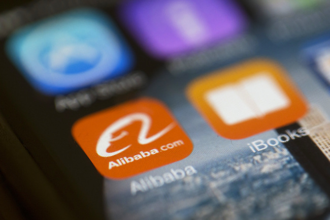 The Alibaba Group Holding app logo is displayed on an iPhone in Hong Kong. (Bloomberg)