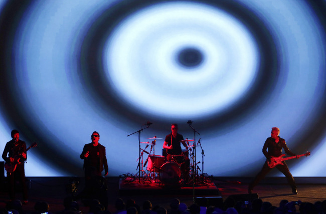 U2 performs during Apple Inc.’s product announcement at Flint Center in Cupertino, California, on Tuesday. (Bloomberg)