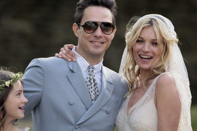 Kate Moss and her new husband Jamie Hince pose for photographs outside St. Peter’s Church in Southrop, Gloucestershire, July 1, 2011. Moss, 37, and Hince, 42, a guitar player with The Kills, posed for photos outside the church in the village of Southrop in southern England after the ceremony. (Chicago/PA Photos/Abaca Press/MCT)