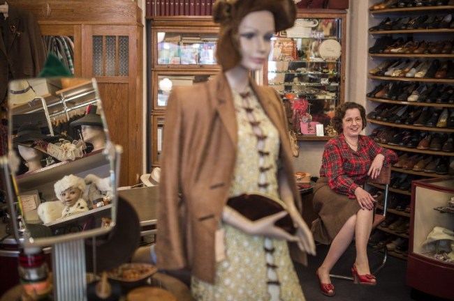 Shop owner Constanze Pelzer, dressed in 1940s vintage garments, sits among clothes and paraphernalia in her 1920s-1950s vintage shop Glencheck in the Wilmersdorf area of Berlin. Pelzer’s boutique, which she said had sourced costumes for World War II films such as “The Reader” and “The Monuments Men,” helps make Berlin a magnet for vintage enthusiasts. (AFP-Yonhap)