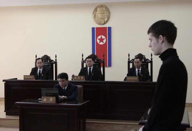 Matthew Miller, a U.S. citizen, stands during his trial at the Supreme Court in Pyongyang, North Korea, on Sunday. (AP-Yonhap)