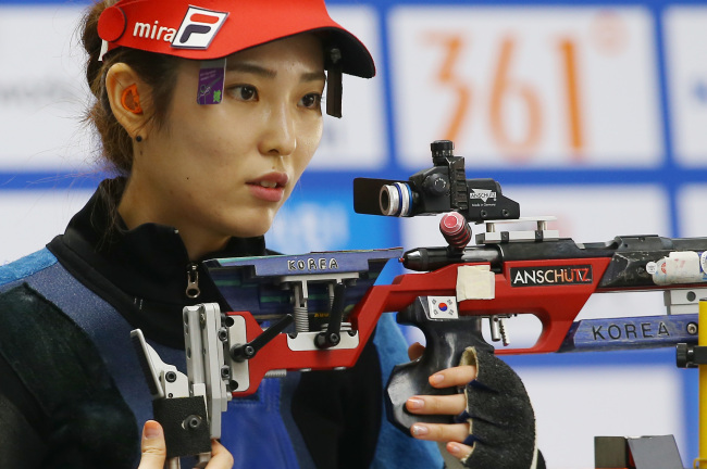 Korea’s Jeong Mi-ra competes in the women’s rifle three-position event on Friday. (Yonhap)