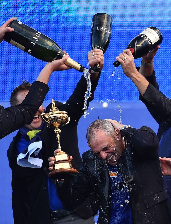 Team Europe captain Paul McGinley is doused with champagne after the Ryder Cup win on Sunday. (AFP-Yonhap)