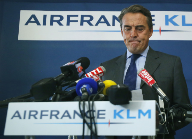 Head of Air France-KLM Alexandre de Juniac pauses as he speaks during press conference in Paris on Sunday. (AP-Yonhap)