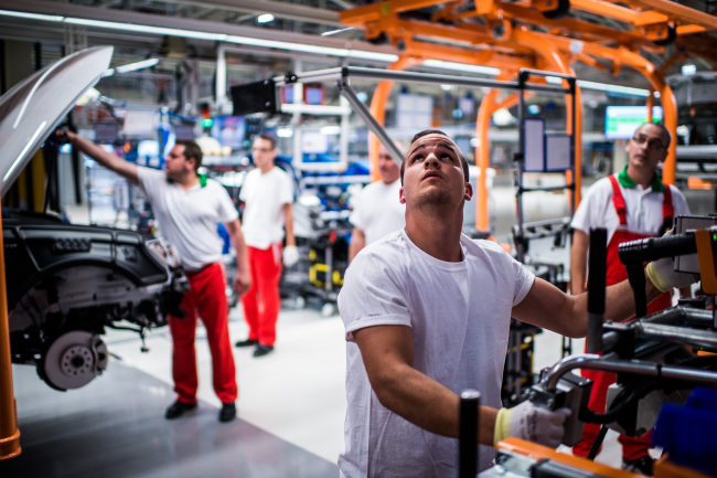 Employees work on the assembly of Audi A3 vehicles line at an Audi plant in Gyor, Hungary. (Bloomberg)