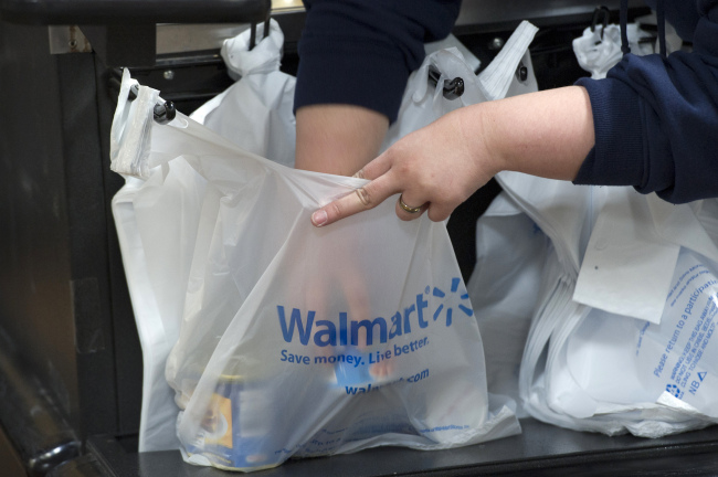 An employee bags merchandise at a Wal-Mart store in American Canyon, California. (Bloomberg)