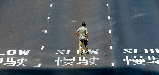 A man walks along Connaught Road Central in Hong Kong. (Bloomberg)