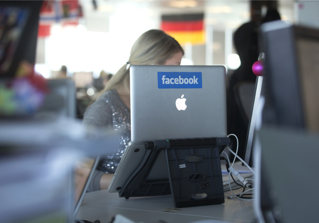 An Apple’s laptop computer with the Facebook logo is on display at the offices of Facebook’s European headquarters at Hanover Quay in Dublin, Ireland. (Bloomberg)