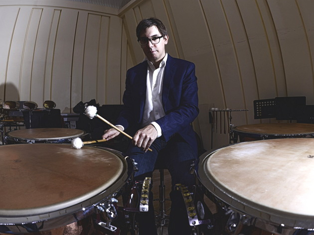 Adrien Perruchon, the principal timpanist for the Seoul Philharmonic Orchestra, poses with his timpani in the main rehearsal room of the orchestra at Sejong Center for the Performing Arts in Seoul on Monday. (Park Hae-mook/The Korea Herald)