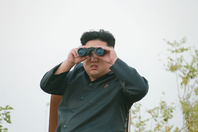 North Korea’s media reported Sunday that its leader Kim Jong-un inspected an air base. (Yonhap)