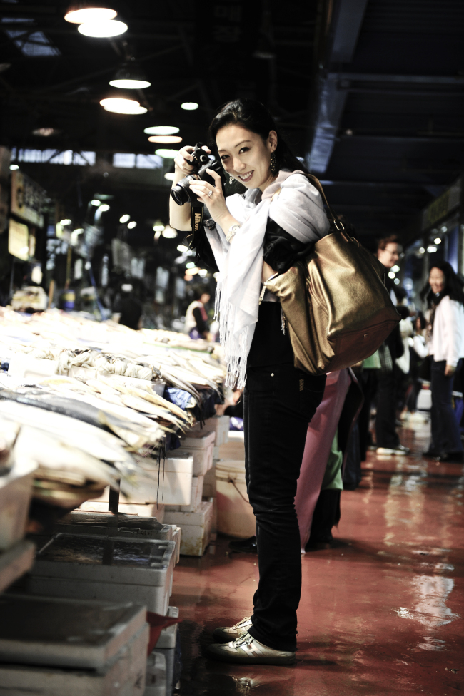 Judy Joo visits a fish market in Seoul with a camera. (Jason Lang)