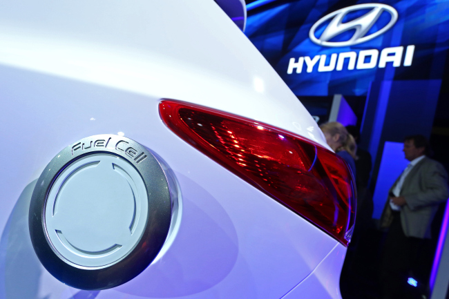 The hydrogen tank cover on a Hyundai Tucson fuel cell vehicle is seen at the 2013 LA Auto Show. (Bloomberg)