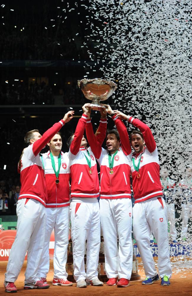 Team Switzerland celebrates after winning the Davis Cup on Sunday. (AFP-Yonhap)