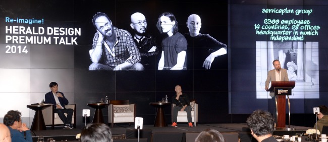 Global chief creative officer and partner of Serviceplan Group Alexander Schill (right) speaks about innovation in advertising at the 2014 Herald Design Premium Talk on Wednesday at the JW Marriott Dongdaemun Seoul. (Park Hyun-koo/The Korea Herald)