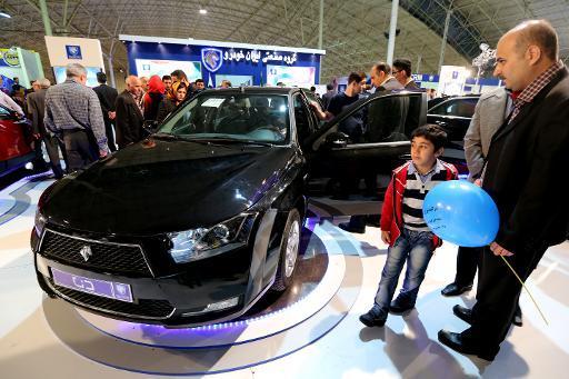 Visitors look at the new sedan Dena, manufactured by Iran’s automaker Iran Khodro, during the International Car Exhibition in the northern city of Tabriz on Oct. 14. (AFP)