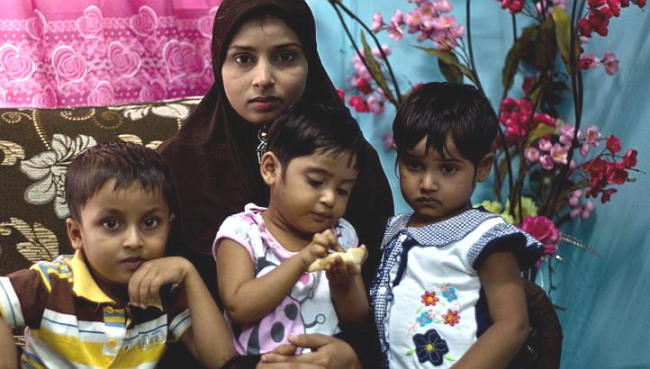 Ms. Bibijan Rahimullah and her three young children endured a harrowing, monthlong odyssey by sea and land to Malaysia. (AFP)