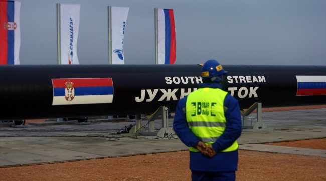 A worker stands next to steel pipes during the ceremony marking the start of the construction of the South Stream gas pipeline at a field north of Belgrade, Serbia. (EPA-Yonhap)