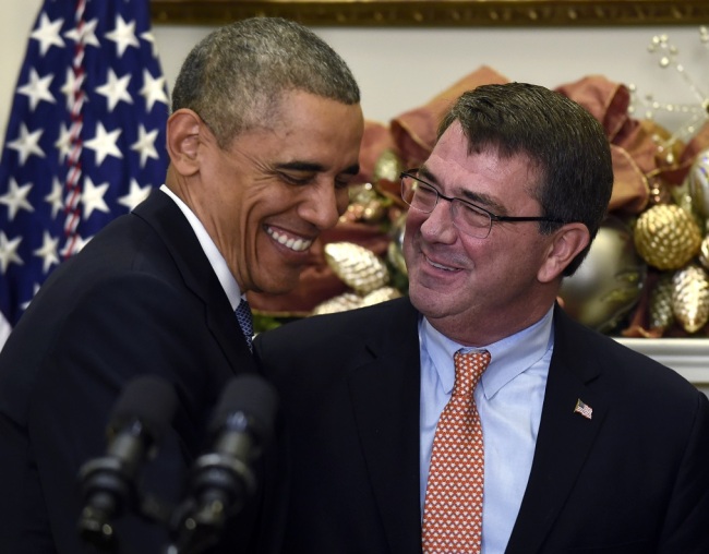 President Barack Obama shares a laugh with Ashton Carter, his nominee for defense secretary, Friday, Dec. 5, 2014, during the announcement in the Roosevelt Room of the White House in Washington. (AP)