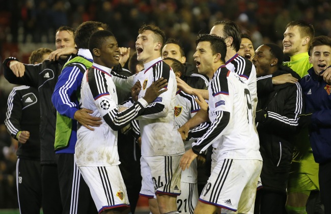 Basel players celebrate at the end of their match against Liverpool on Tuesday. (AP-Yonhap)