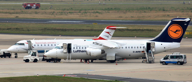 An Austrian Airlines airplane and a Deutsche Lufthansa airplane sit on the tarmac at Cologne airport in Cologne, Germany. (Bloomberg)