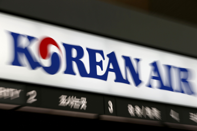 A Korean Air logo is displayed above the carrier’s counter at Incheon International Airport. (Bloomberg)