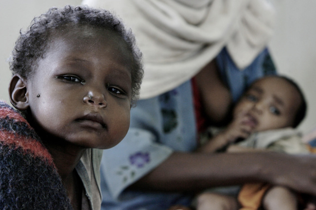 A boy sits on a mattress at a feeding center in Damota Pulassa, Wolayta, Ethiopia. (Bloomberg)