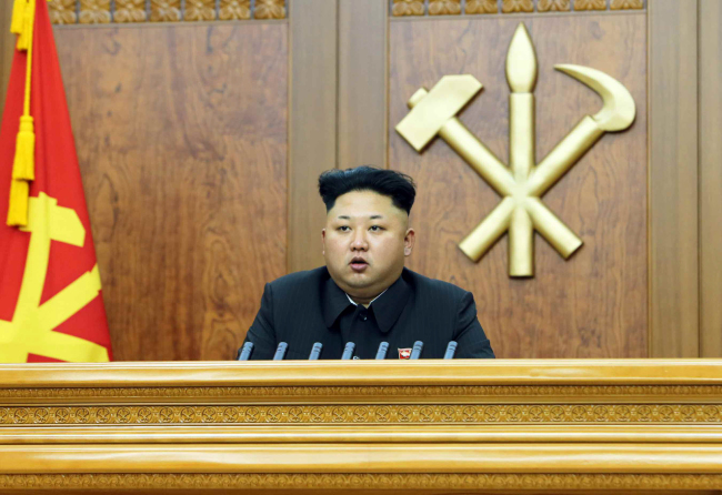 North Korean leader Kim Jong-un delivers his New Year’s Day address in Pyongyang on Thursday. (Yonhap)