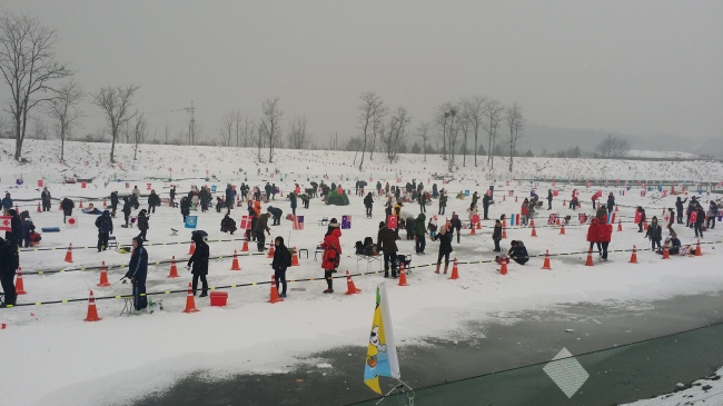 Visitors fish for trout at Paju Trout Festival last year.