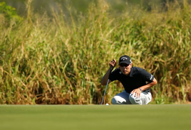 Korea’s Bae Sang-moon lines up a putt on the 11th hole on Saturday. (AFP-Yonhap)