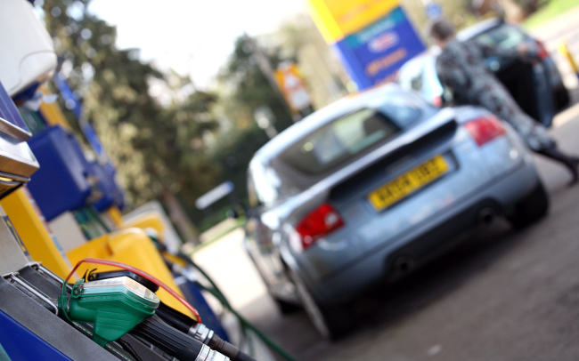 A motorist leaves after filling her vehicle at a gas station in Stansted Mountfitchet, Essex, England. (Bloomberg)