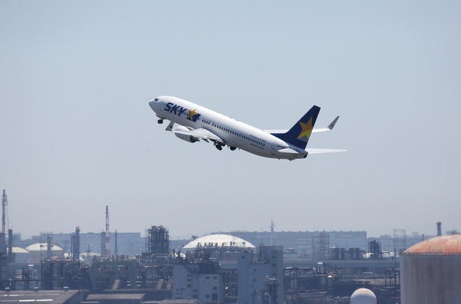 A Skymark Airlines aircraft takes off at Haneda Airport in Tokyo. (Bloomberg)