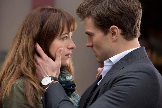 Dakota Johnson and James Dornan star in “Fifty Shades of Grey.” (Universal Pictures)