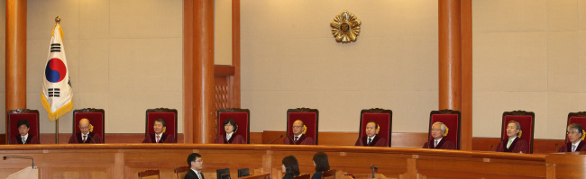 Nine judges deliver a decision at the Constitutional Court in Seoul on Thursday. (Yonhap)