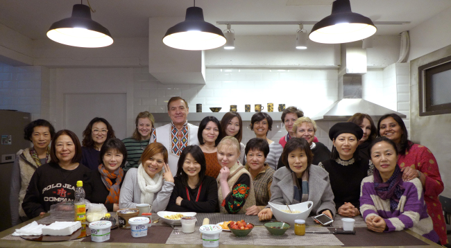 The Seoul International Women’s Association members participate in an international culinary exchange event in late-February.