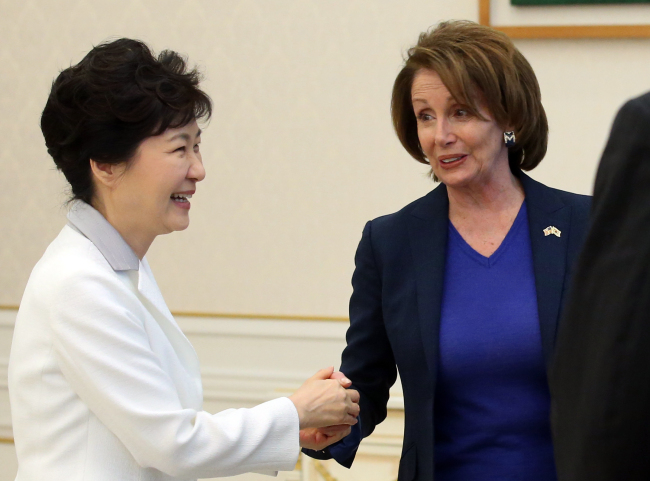 President Park Geun-hye welcomes U.S. House Minority Leader Nancy Pelosi at the presidential office of Cheong Wa Dae Thursday. (Yonhap)