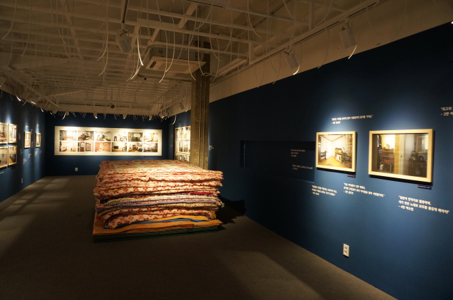 An exhibition view of “The Children’s Room,” which displays photos of empty rooms that used to belong to student victims of the Sewol ferry sinking (Lee Woo-young/The Korea Herald)