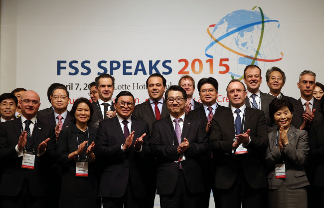 FSS Gov. Zhin Woong-seob (third from right, front row) poses with participants at the opening session of FSS Speaks 2015 in Seoul on Tuesday. (Yonhap)