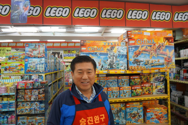 Song Dong-ho runs Seung Jin Toy in Seoul, specializing in Lego products. (Yoon Sarah/The Korea Herald)