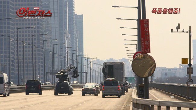 Captain America hangs onto a truck as it crosses Mapo Bridge. Marvel Studios