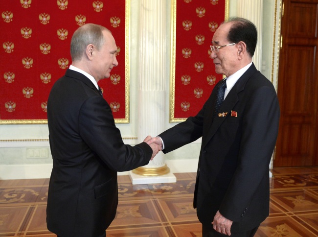 Russian President Vladimir Putin (left) and North Korean Chairman of the Presidium of the Supreme People’s Assembly Kim Yong-nam shake hands at their meeting in the Kremlin in Moscow, Russia, Saturday. (AP-Yonahp)