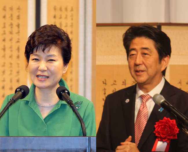 President Park Geun-hye and Japanese Prime Minister Shinzo Abe speak during separate events to mark the 50th anniversary of the normalization of bilateral diplomatic relations in Seoul and Tokyo, respectively, Monday. (Yonhap)