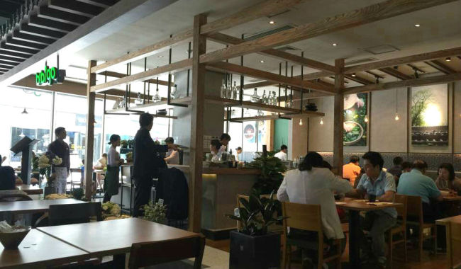 Customers dine at the Bibigo restaurant at Wangjing SOHO in Wangjing, north of Beijing, China. (CJ Foodville)