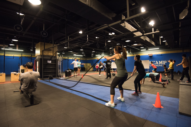 Members of Reebok CrossFit Sentinel Uptown in Gangnam, Seoul, complete workouts in a Bootcamp class. (Reebok CrossFit Sentinel)