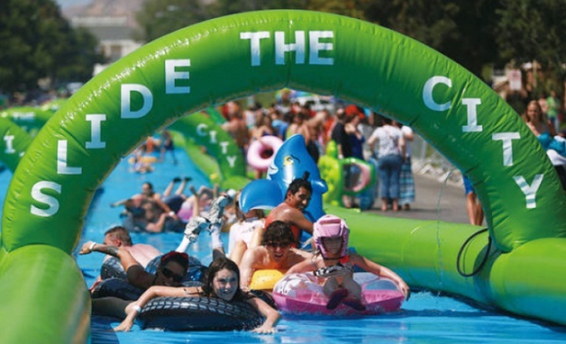 A water fight festival takes place on a water slide, named “Slide the City,” in Yeouido Hangang Park, near central Seoul. (Seoul Metropolitan Government)