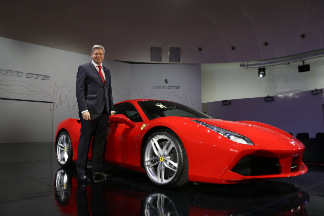 FERRARI 488 GTB -- Dieter Knechtel, managing director of Ferrari Far East, poses with the Ferrari 488 Gran Turisom Berlinetta, a sports car with an eight-cylinder mid-rear engine that boasts 670 horsepower at 8,000 rpm. Forty years after the launch of the 308 GTB, the Ferrari 488 GTB reaches 100 km/h speed from 0 in three seconds and requires only 117 meters to make a complete stop from 200 km/h speed. (FMK)